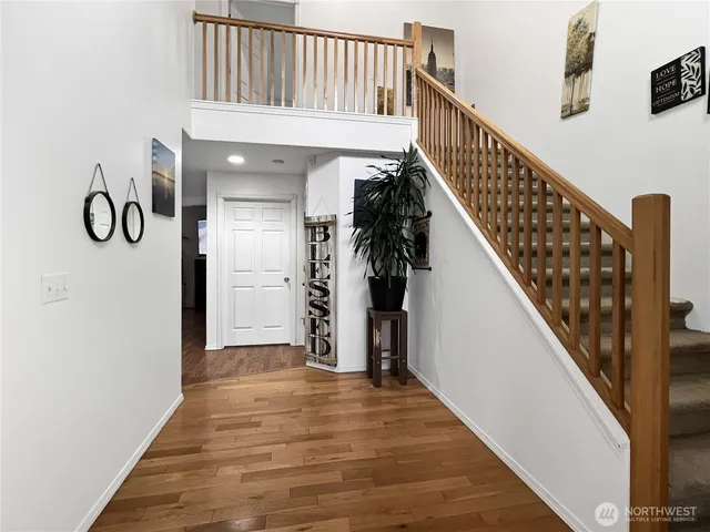 a view of entryway with wooden floor
