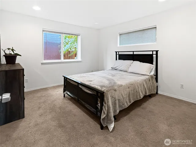 a bedroom with a bed and window