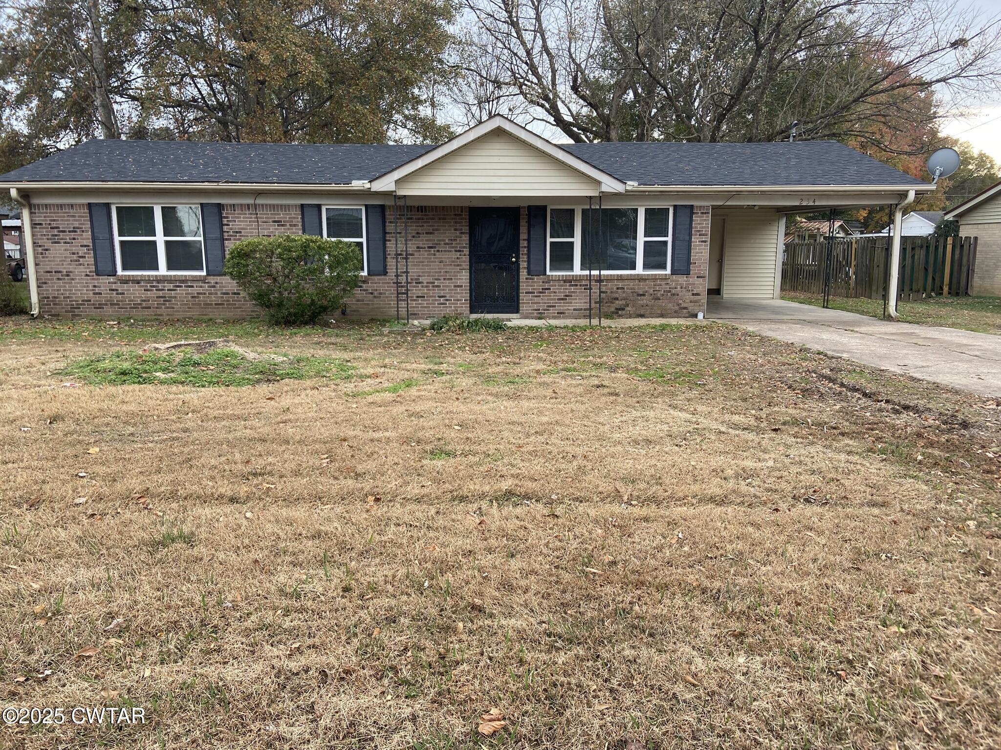 front view of a house with a yard