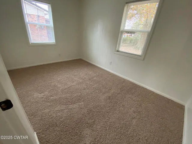a bathroom with a sink mirror and toilet