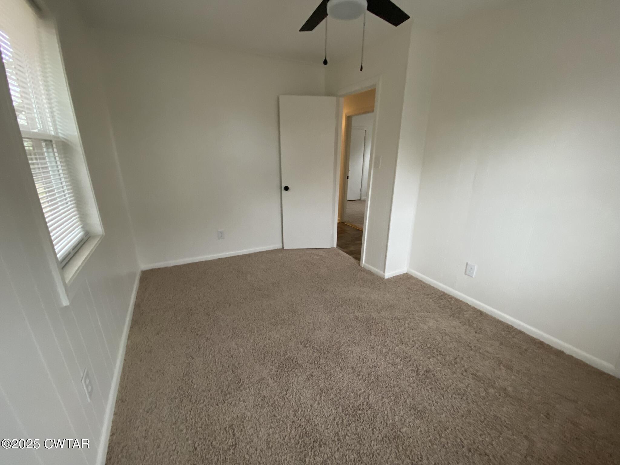 234 Tulip Street Henderson, TN 38340 - Photo 12 of 14 a view of empty room with windows