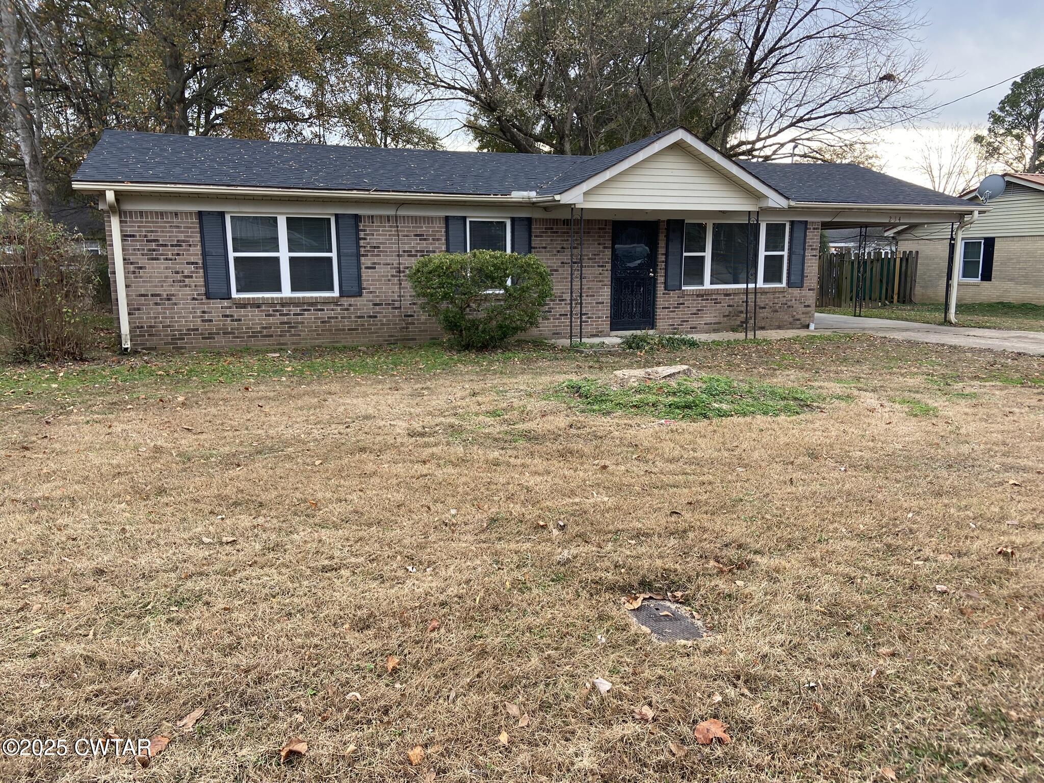 234 Tulip Street Henderson, TN 38340 - Photo 2 of 14 front view of a house with a yard