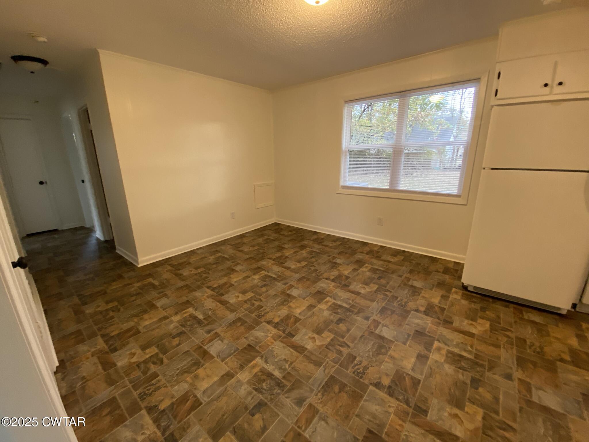 234 Tulip Street Henderson, TN 38340 - Photo 6 of 14 a view of an empty room with a window