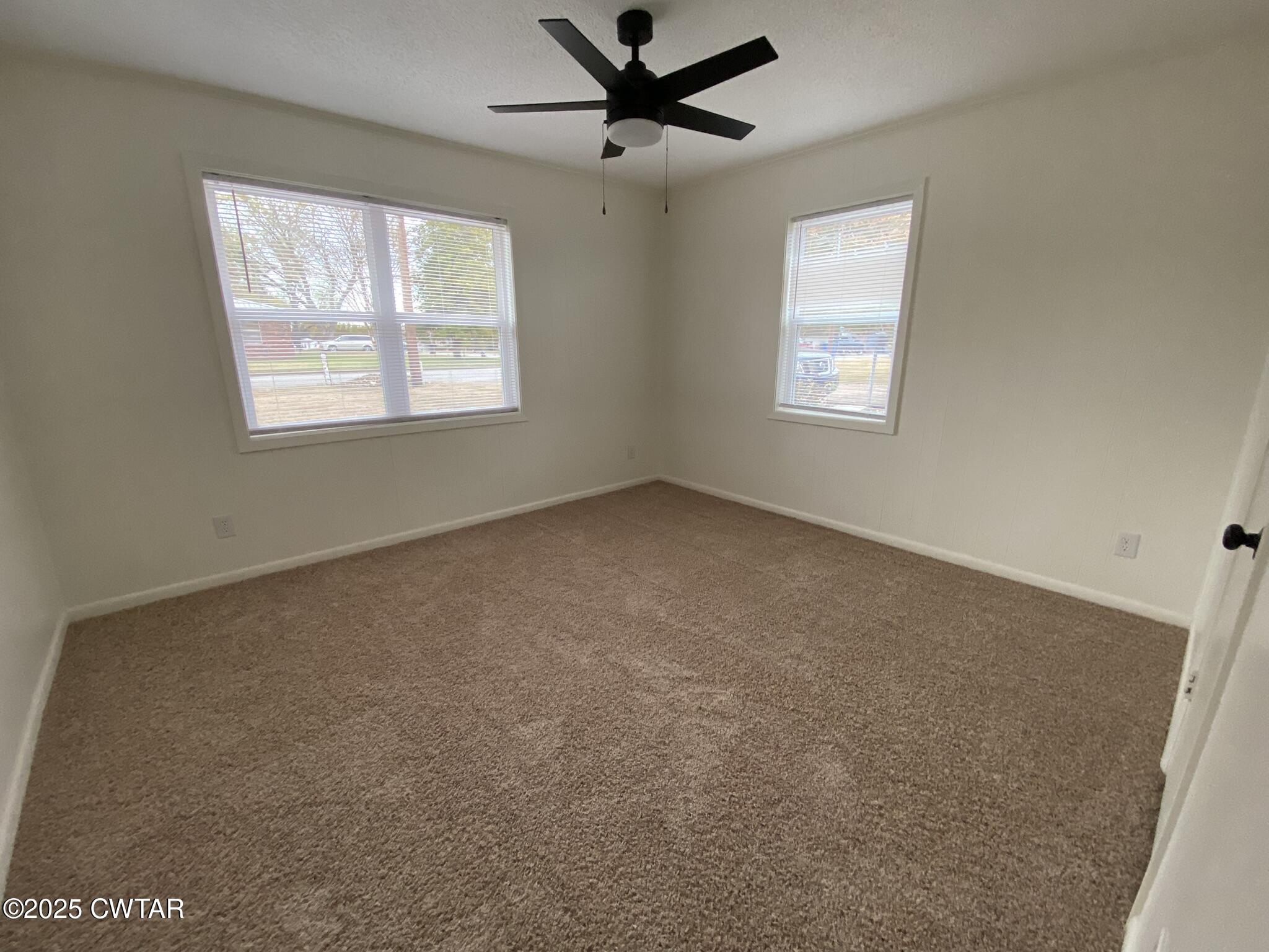 234 Tulip Street Henderson, TN 38340 - Photo 10 of 14 a view of an empty room with a window