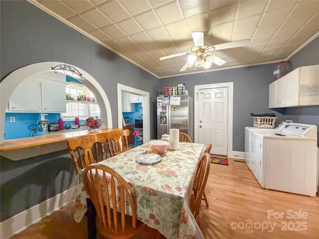 a very nice looking dining room with a large window