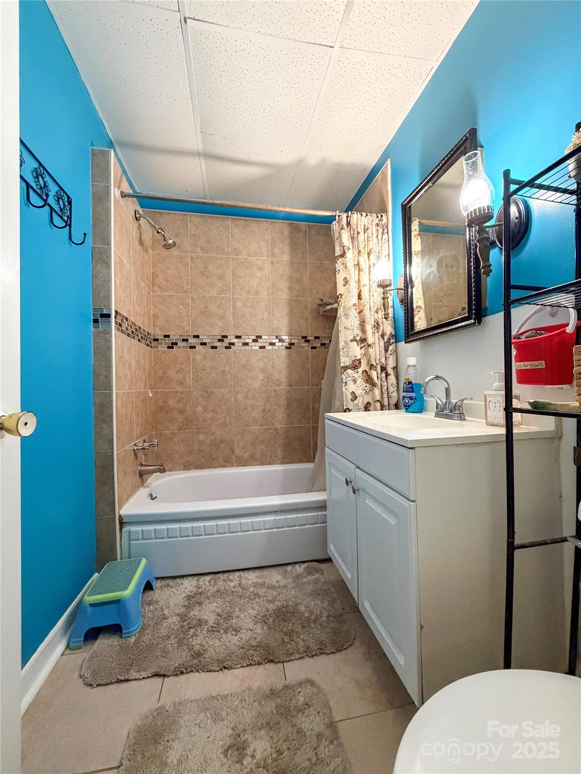 618 Clyde Street Gastonia, NC 28052 - Photo 6 of 8 a bathroom with a sink toilet and shower