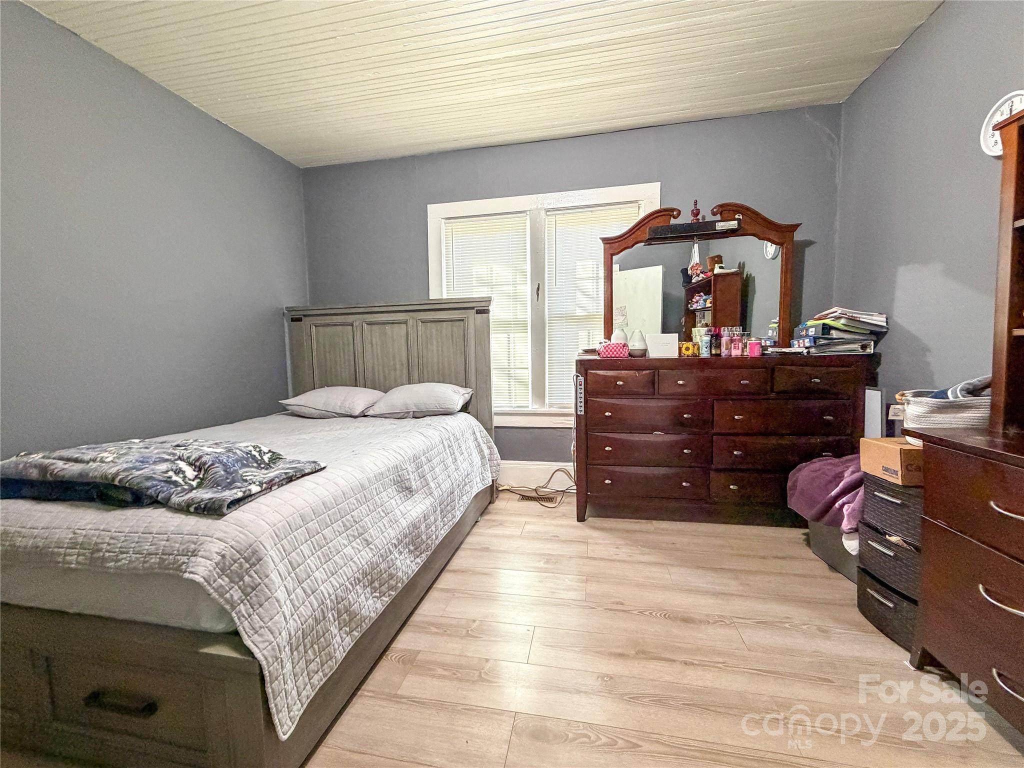 618 Clyde Street Gastonia, NC 28052 - Photo 7 of 8 a bedroom with a bed and a dresser