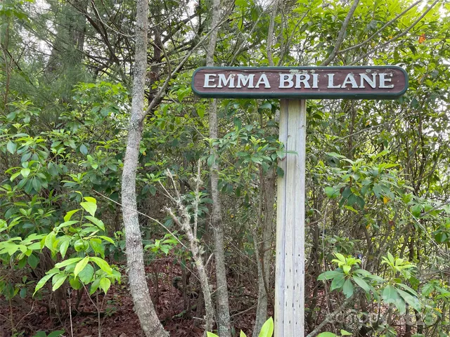 a sign on the side of a tree