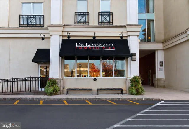 a view of a lake with large trees
