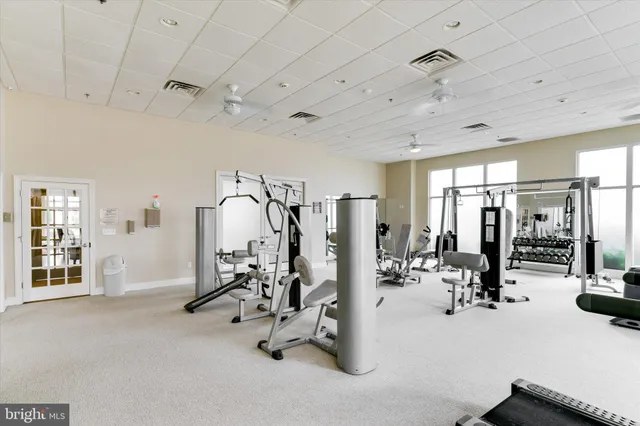 a spacious bathroom with a tub and mirror