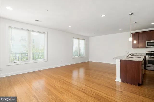 a view of kitchen and wooden floor