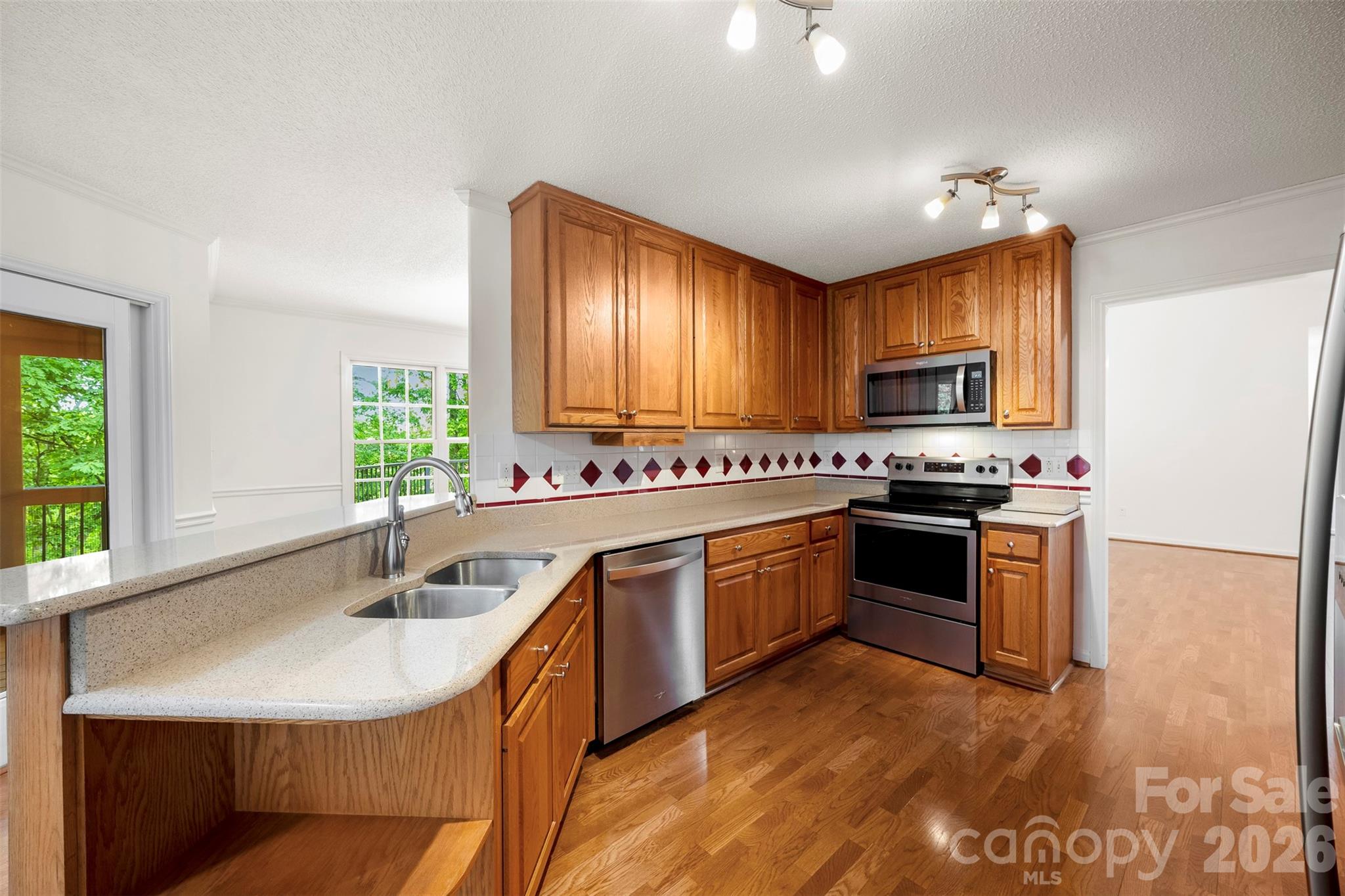 1917 Rucker Road Shelby, NC 28152 - Photo 12 of 41 a kitchen with kitchen island granite countertop a sink cabinets and stainless steel appliances