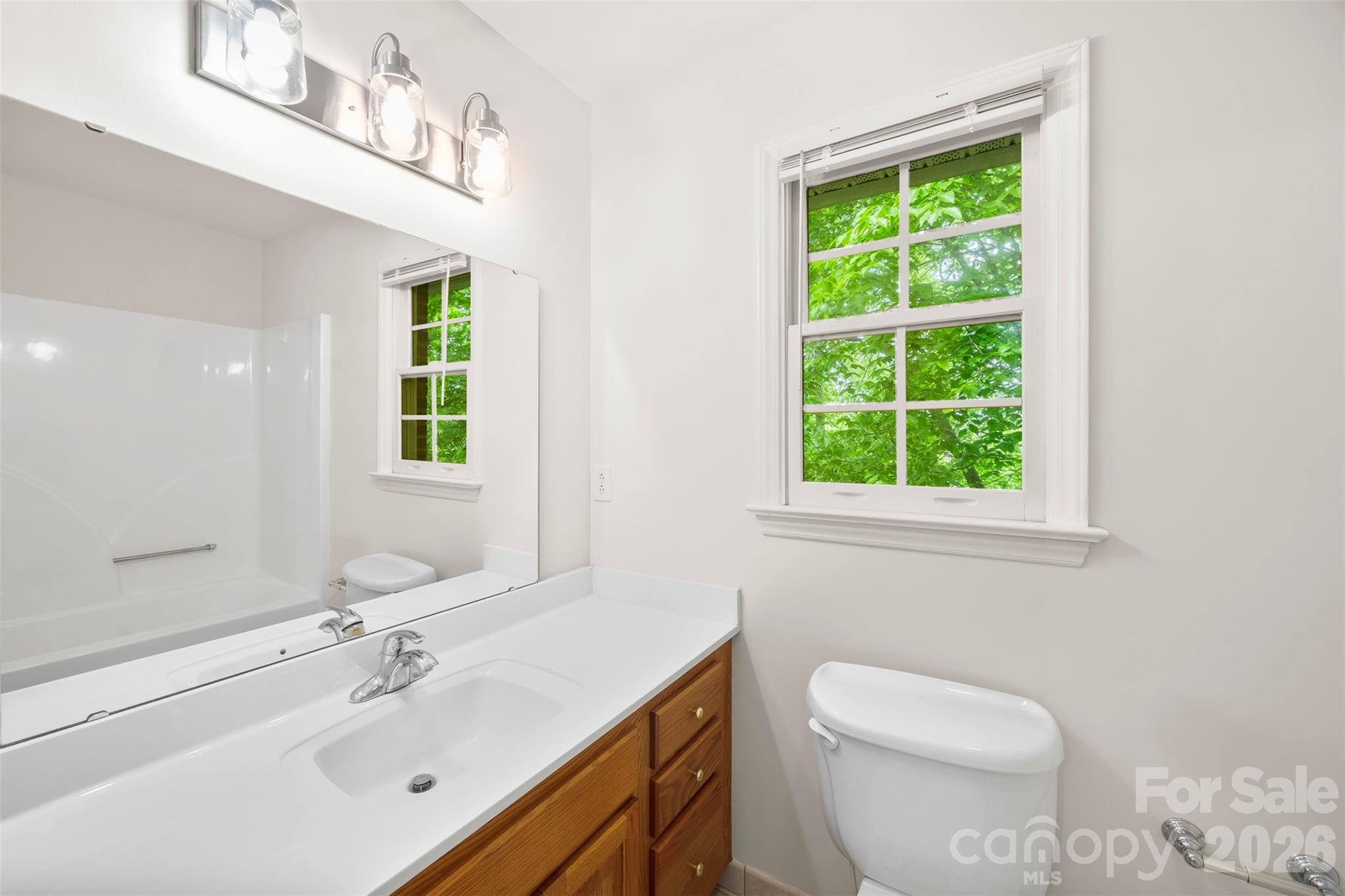1917 Rucker Road Shelby, NC 28152 - Photo 24 of 41 a bathroom with a sink a toilet and a window