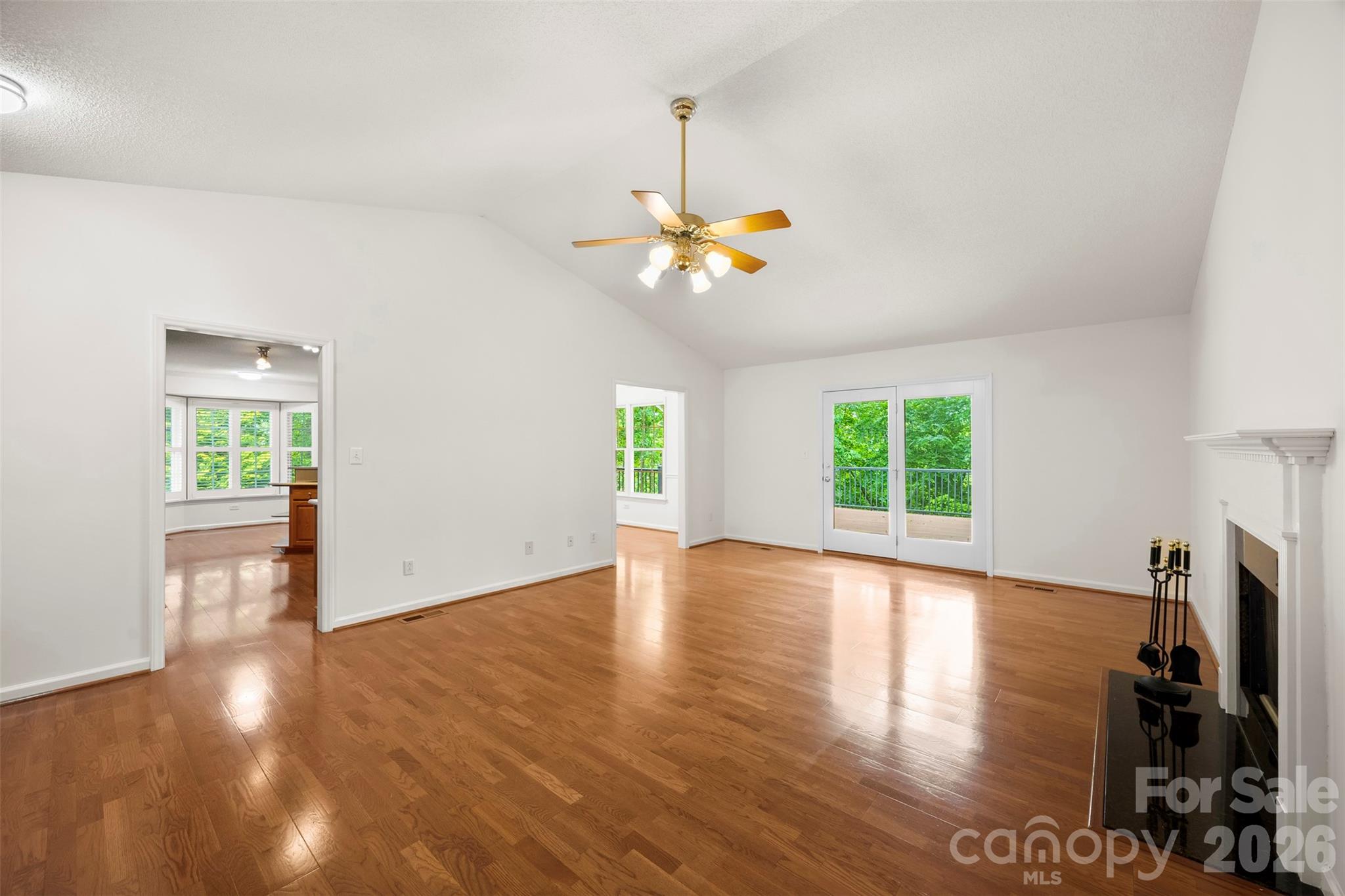 1917 Rucker Road Shelby, NC 28152 - Photo 7 of 41 a view of a livingroom with furniture a ceiling fan and wooden floor