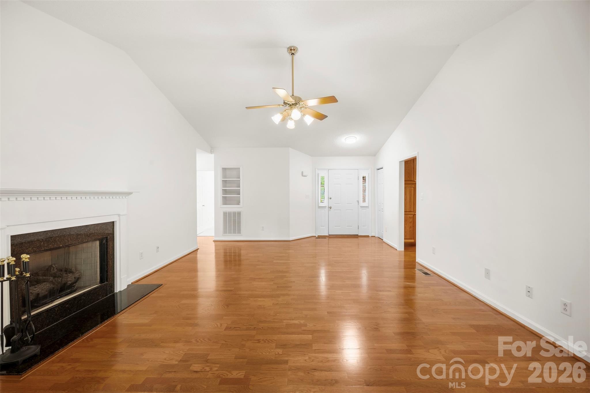 1917 Rucker Road Shelby, NC 28152 - Photo 9 of 41 a view of an empty room with chandelier fan and fire place