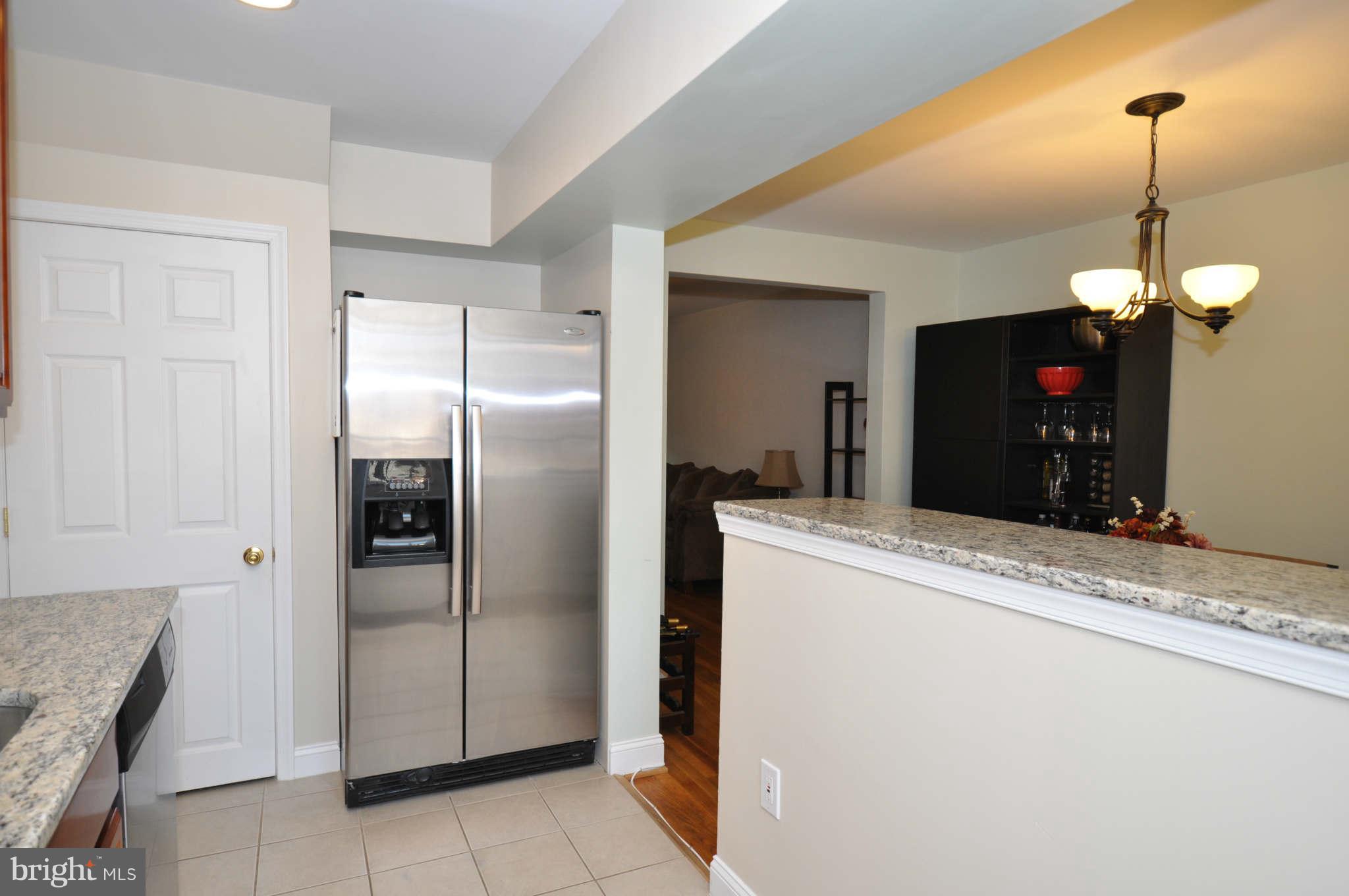 1921 Penhall Road Baltimore, MD 21222 - Photo 14 of 29 a kitchen with stainless steel appliances granite countertop cabinets and a refrigerator