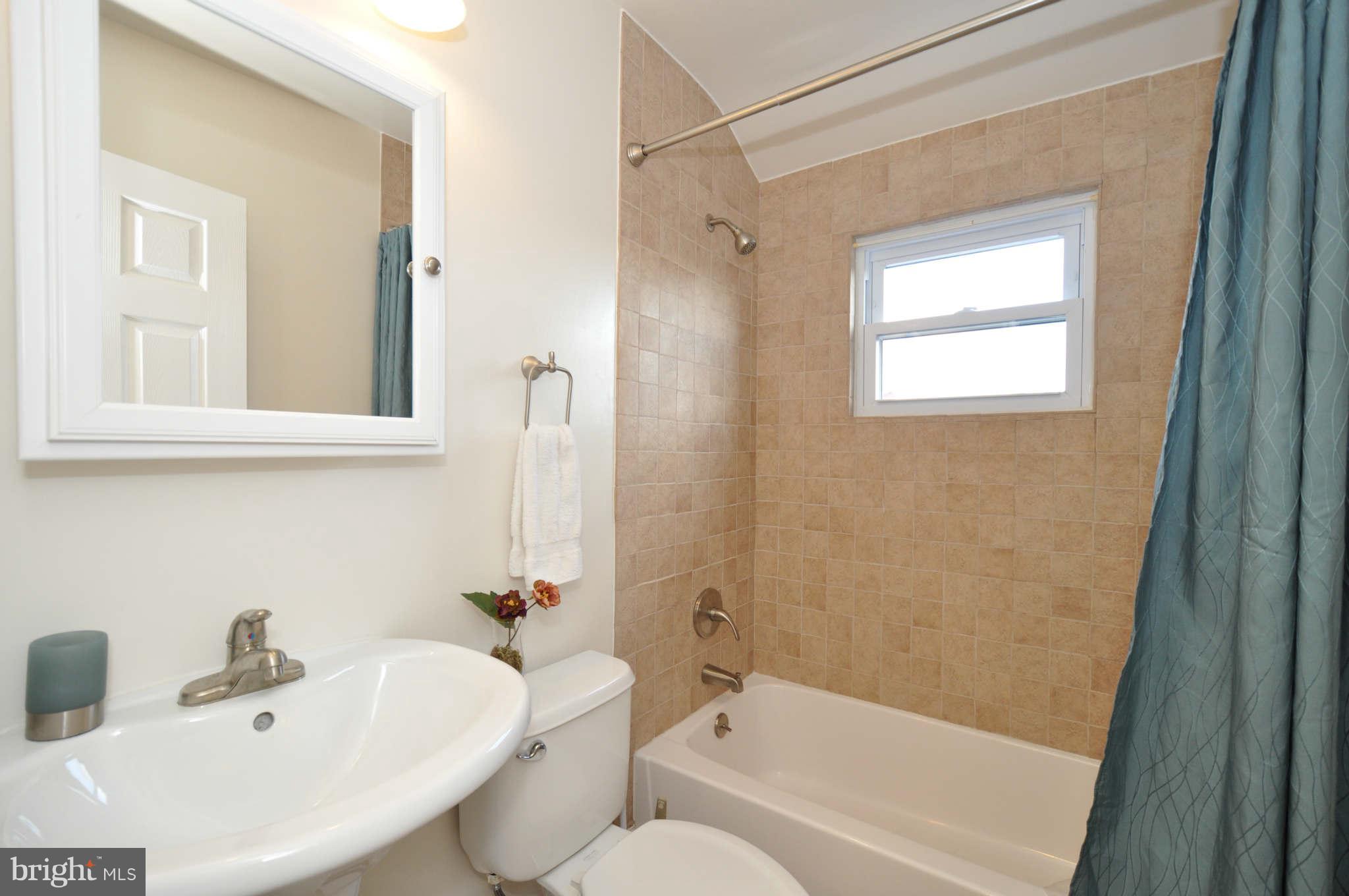 1921 Penhall Road Baltimore, MD 21222 - Photo 16 of 29 a bathroom with a sink and a bathtub