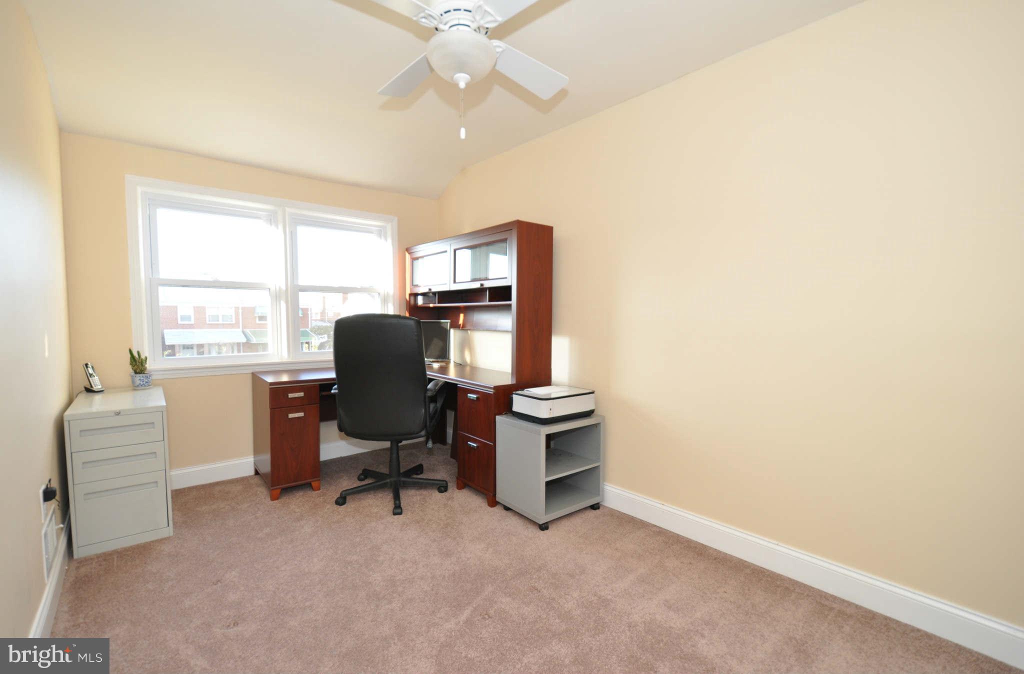 1921 Penhall Road Baltimore, MD 21222 - Photo 20 of 29 a view of a workspace with furniture and a window
