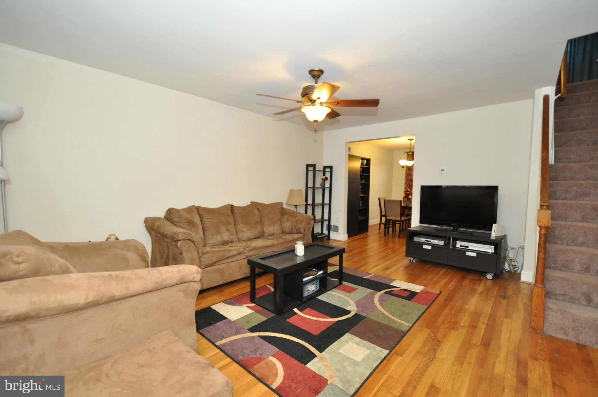1921 Penhall Road Baltimore, MD 21222 - Photo 3 of 29 a living room with furniture and a flat screen tv