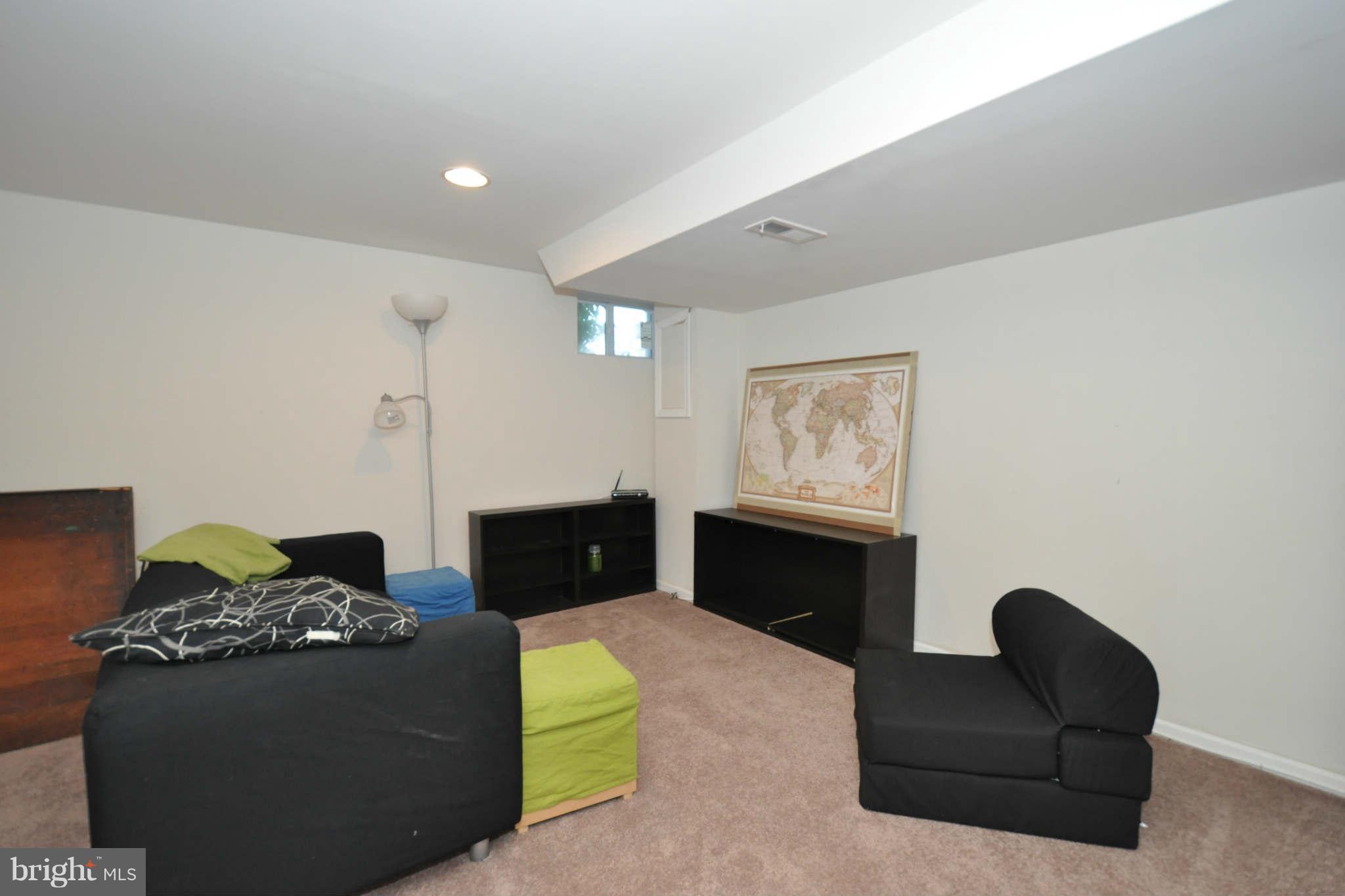 1921 Penhall Road Baltimore, MD 21222 - Photo 23 of 29 a living room with furniture and a flat screen tv