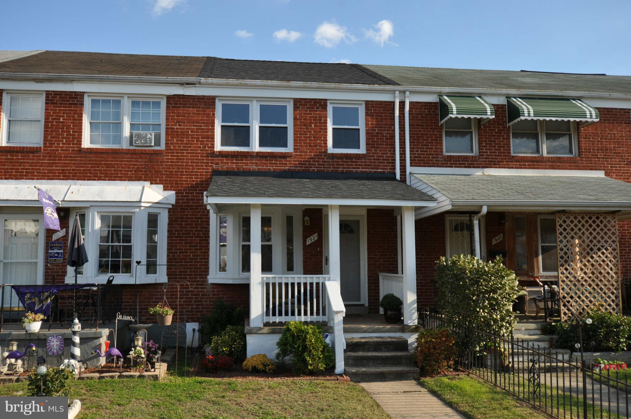 1921 Penhall Road Baltimore, MD 21222 - Photo 29 of 29 front view of a brick house with a yard