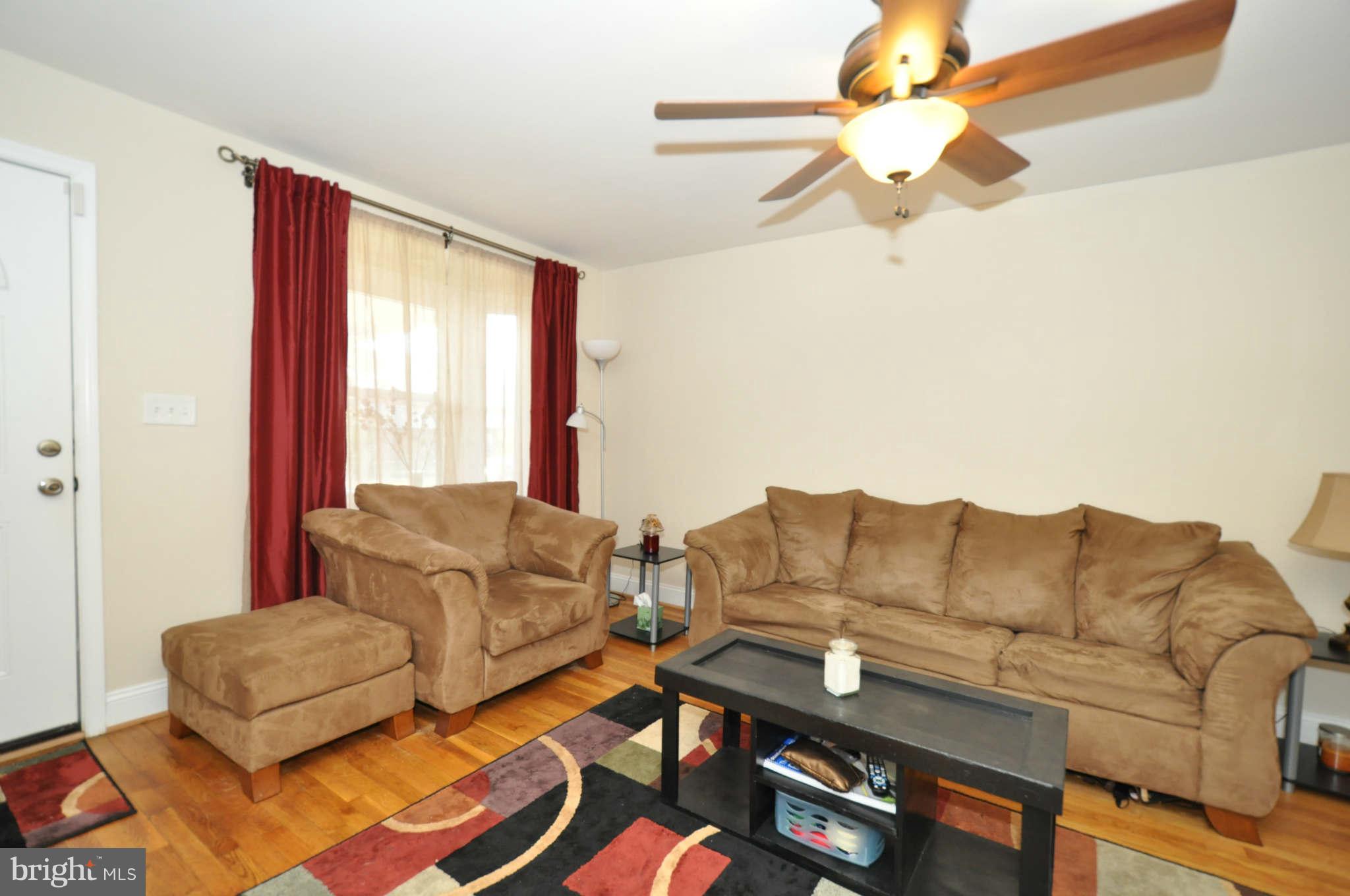 1921 Penhall Road Baltimore, MD 21222 - Photo 4 of 29 a living room with furniture and a couch