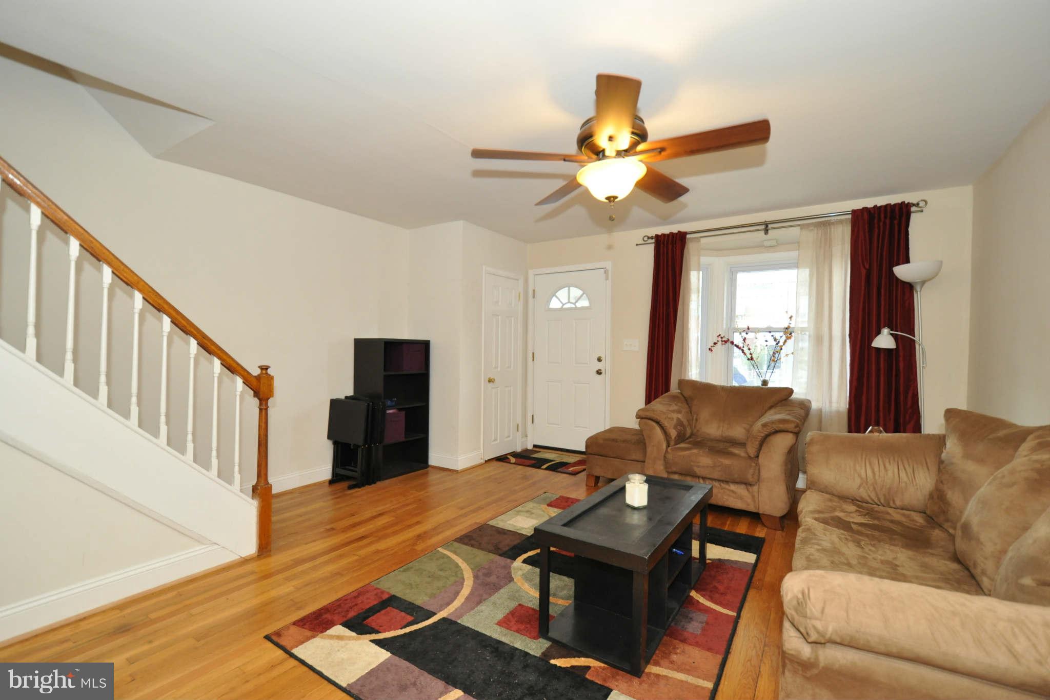 1921 Penhall Road Baltimore, MD 21222 - Photo 7 of 29 a living room with furniture and a ceiling fan