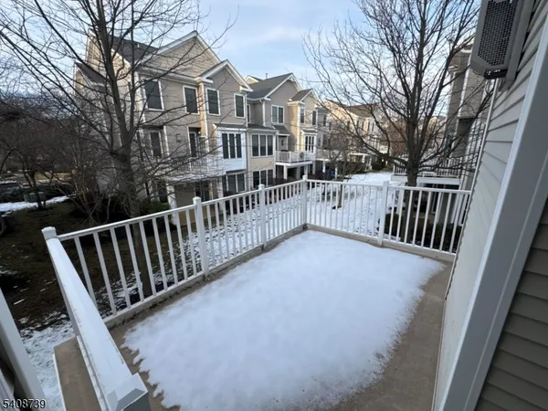 a view of a house with backyard and deck