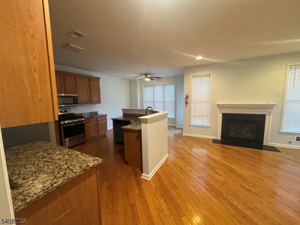 a kitchen with a stove a sink and a refrigerator