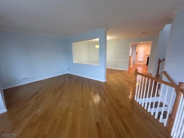 wooden floor in a hall with an entryway