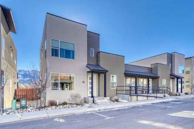 a front view of a building with street view