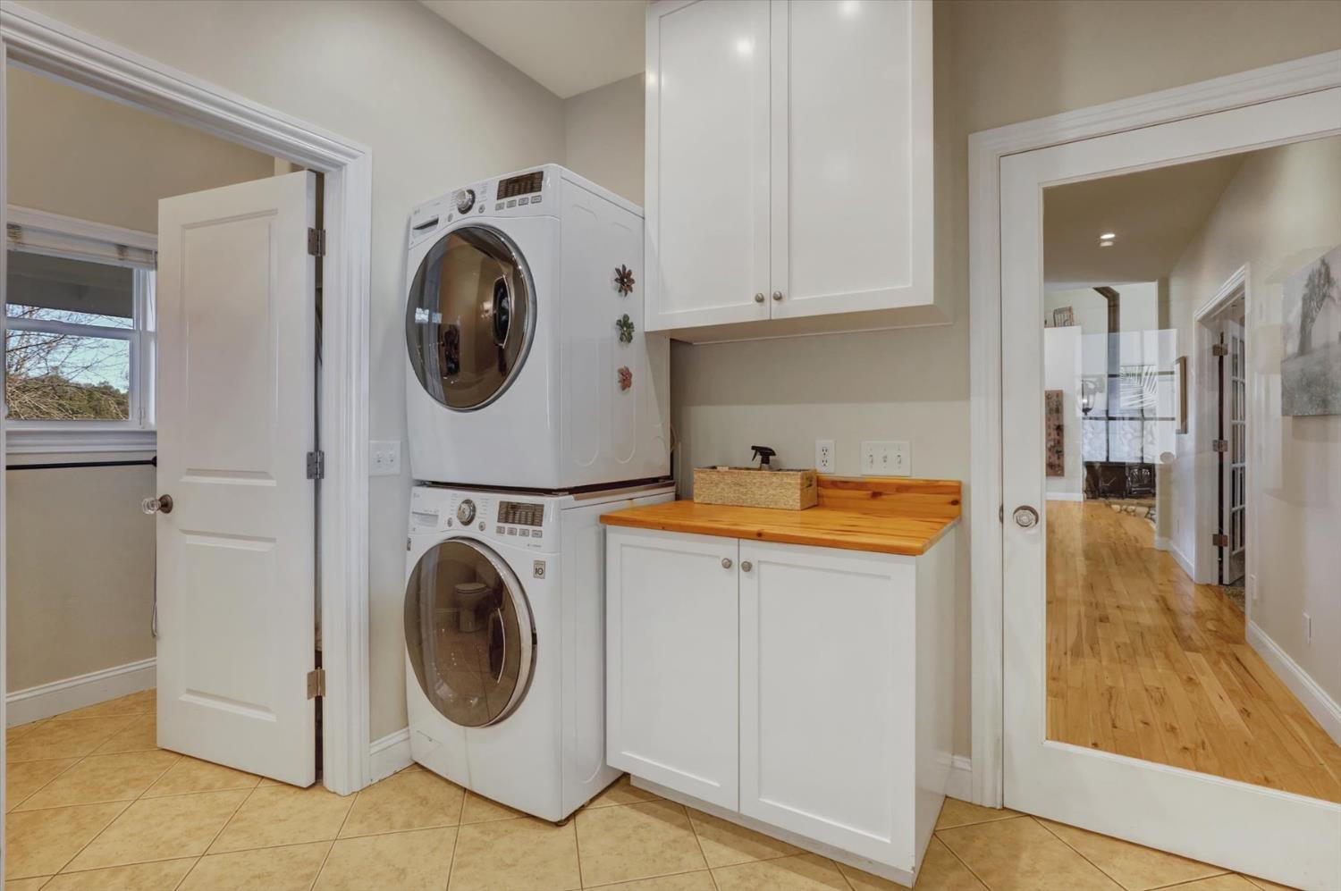 12597 Wolf Road Grass Valley, CA 95949 - Photo 34 of 88 Large mud/room laundry with full bath and utility sink