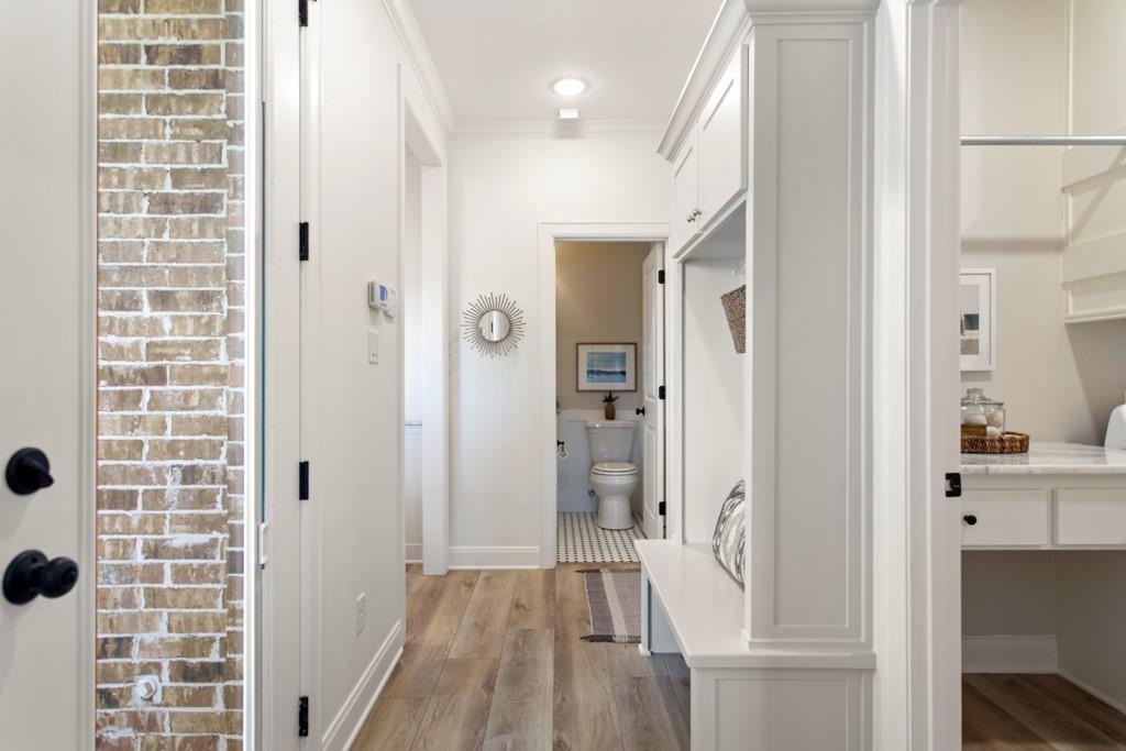 23630 Champion Drive Lindale, TX 75771 - Photo 14 of 36 a view of a hallway with wooden floor and staircase