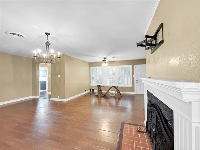 a view of a livingroom with furniture and a ceiling fan