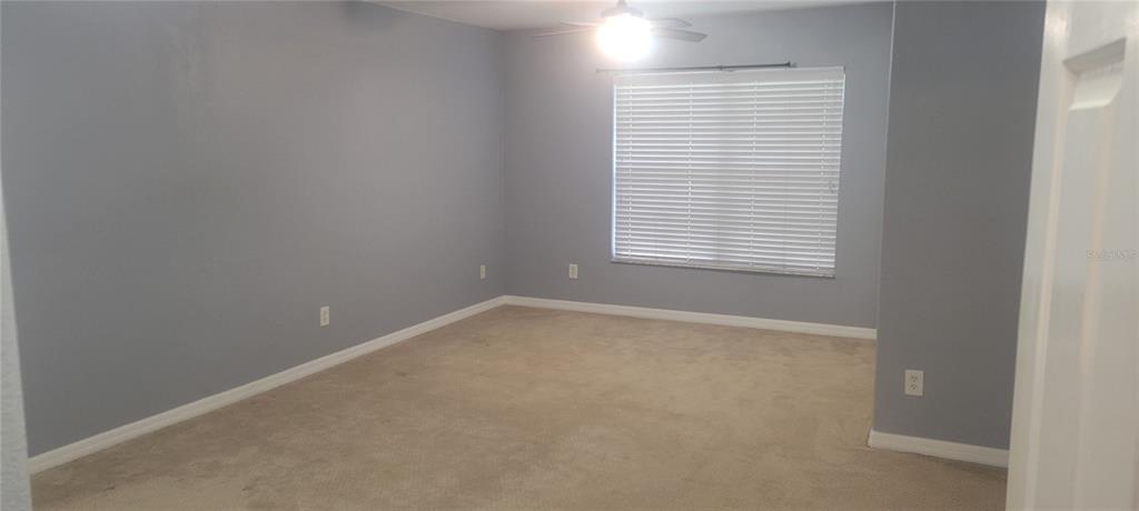 10951 Brickside Court Riverview, FL 33579 - Photo 13 of 31 a view of an empty room with a window