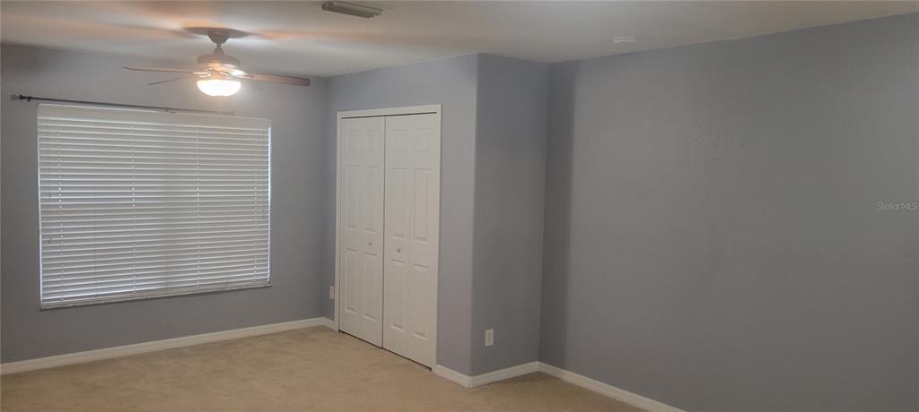 10951 Brickside Court Riverview, FL 33579 - Photo 14 of 31 a view of an empty room with a window