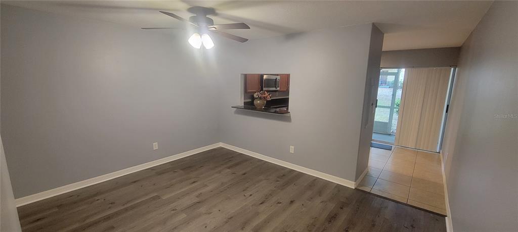 10951 Brickside Court Riverview, FL 33579 - Photo 4 of 31 an empty room with wooden floor and windows