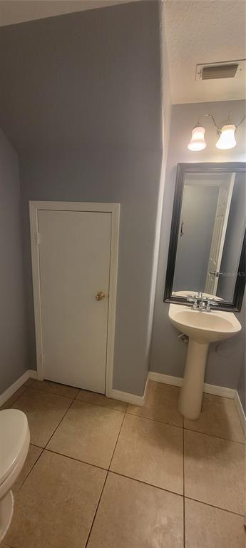 10951 Brickside Court Riverview, FL 33579 - Photo 5 of 31 a bathroom with a sink toilet and mirror