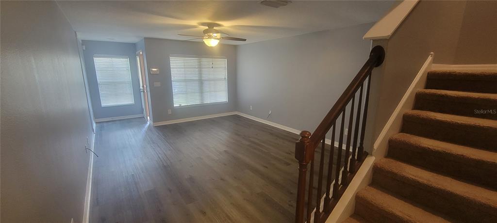 10951 Brickside Court Riverview, FL 33579 - Photo 7 of 31 wooden floor in an empty room with a window