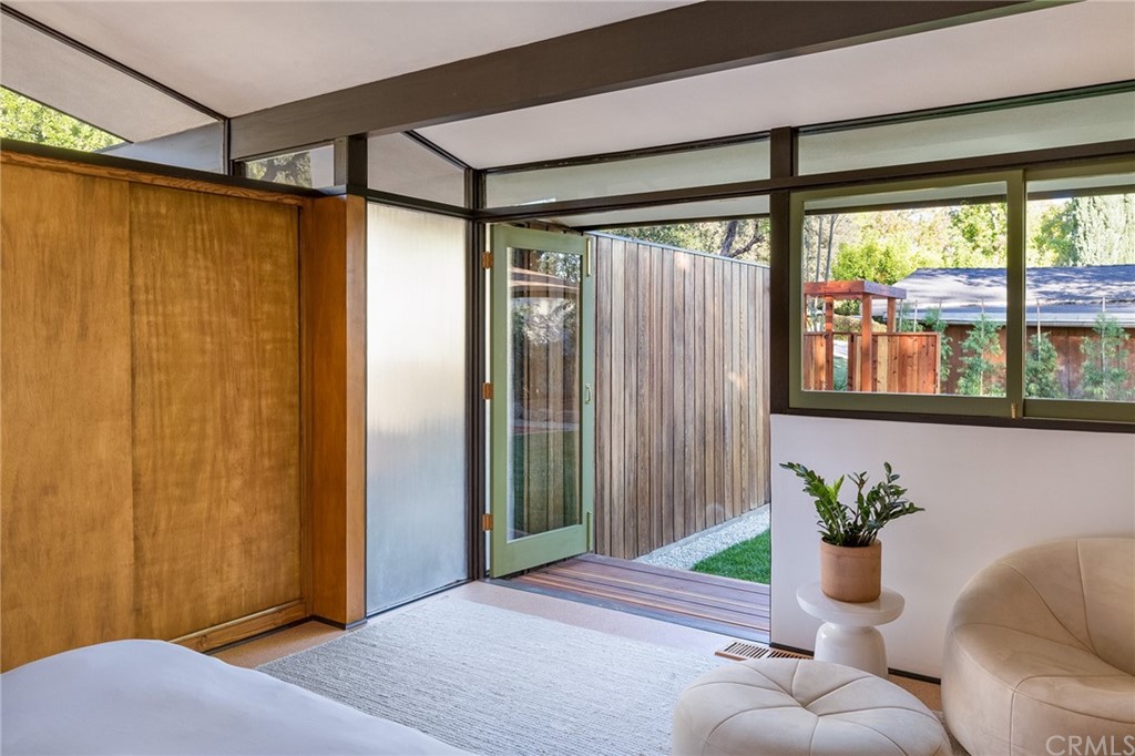 700 Edgeview Drive Sierra Madre, CA 91024 - Photo 17 of 32 a living room with furniture and a window