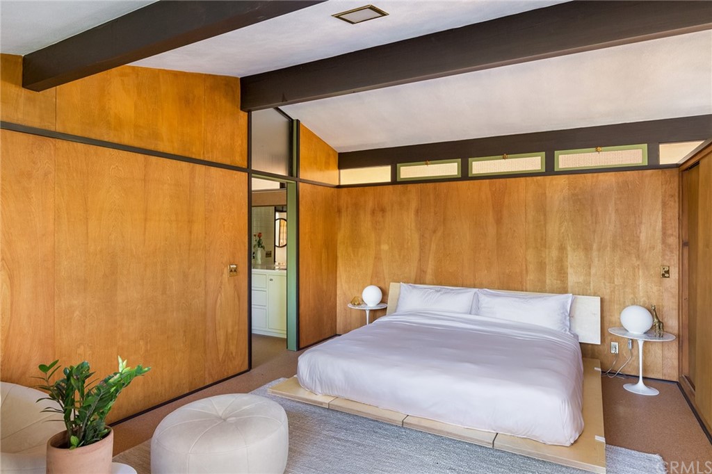 700 Edgeview Drive Sierra Madre, CA 91024 - Photo 19 of 32 a bedroom with a bed and a potted plant