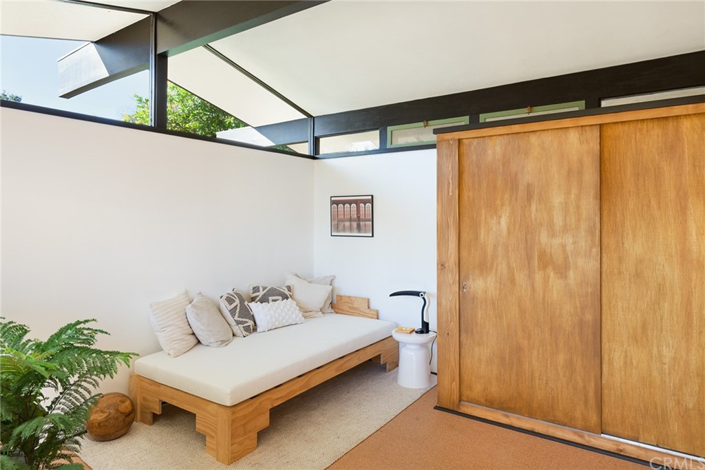 700 Edgeview Drive Sierra Madre, CA 91024 - Photo 24 of 32 a bedroom with a bed and a potted plant on the wall