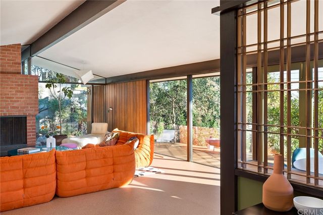 a view of living room kitchen outdoor and a fireplace
