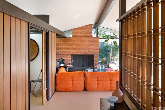 a view of living room with furniture and floor to ceiling window