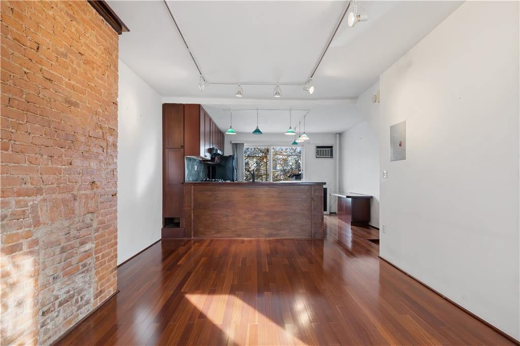 457 44th Street Brooklyn, NY 11220 - Photo 2 of 16 a view of a living room with furniture and wooden floor