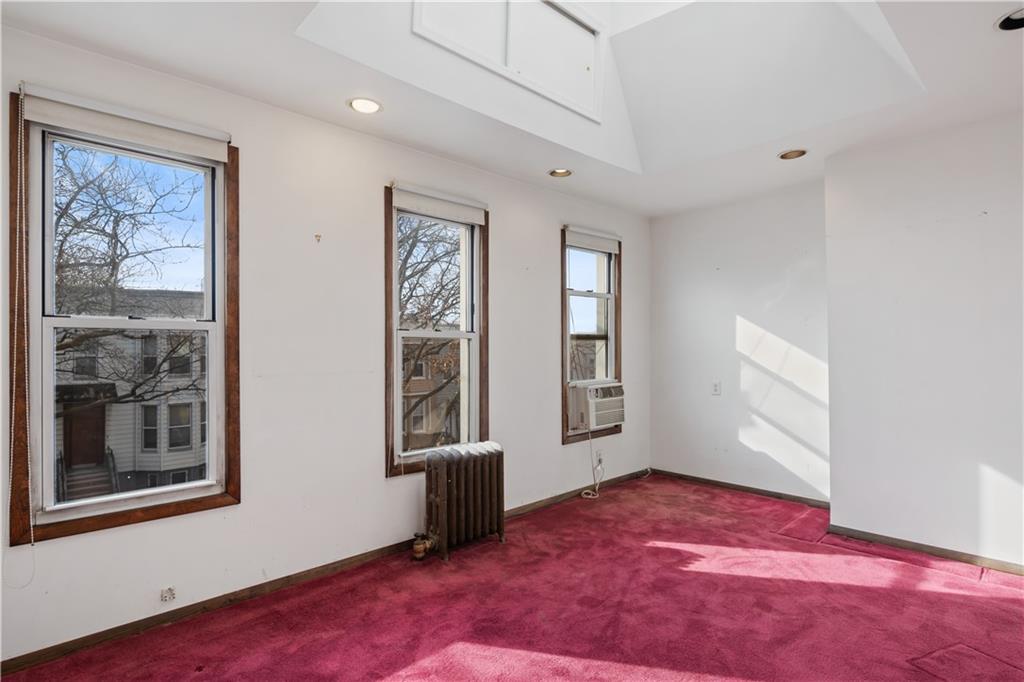 457 44th Street Brooklyn, NY 11220 - Photo 11 of 16 a view of an empty room with a window