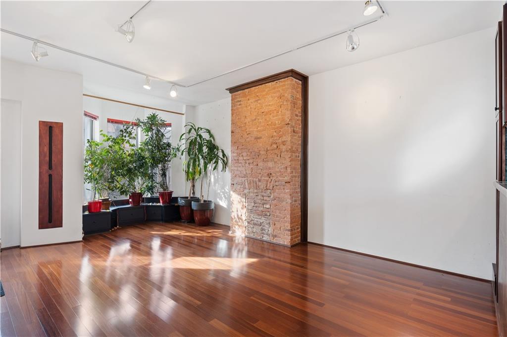 457 44th Street Brooklyn, NY 11220 - Photo 4 of 16 a living room with furniture and a large window