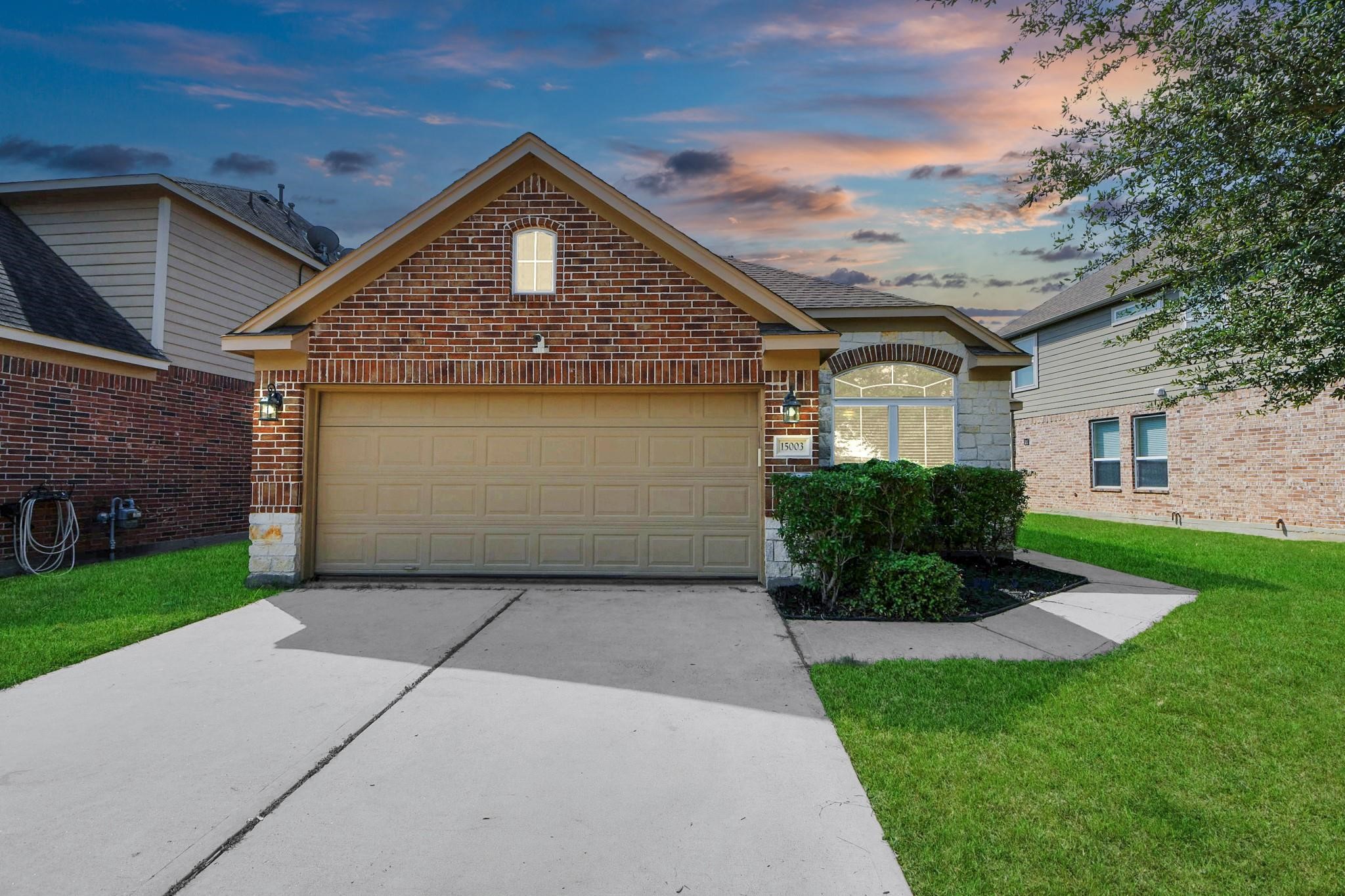 15003 Signal Ridge Way Cypress, TX 77429 - Photo 1 of 40 a front view of a house with a yard