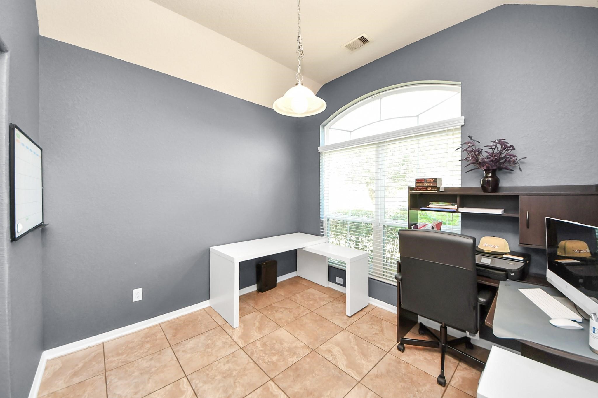 15003 Signal Ridge Way Cypress, TX 77429 - Photo 15 of 40 a view of a workspace with furniture and a window