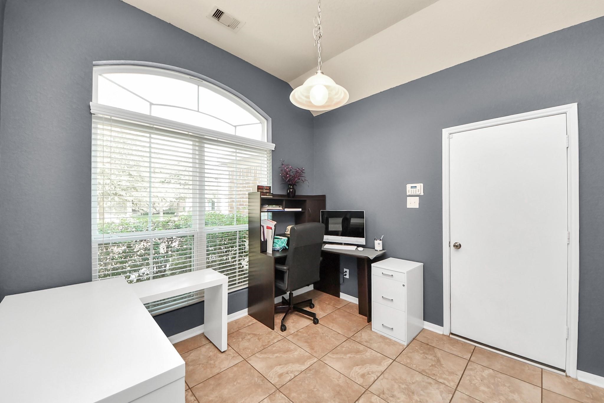 15003 Signal Ridge Way Cypress, TX 77429 - Photo 16 of 40 a view of a workspace with furniture and a window